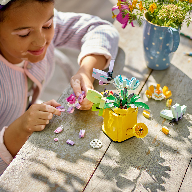 Flowers In Watering Can 