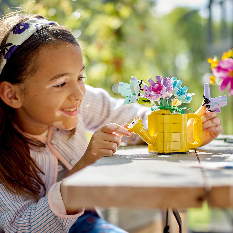 Flowers In Watering Can 